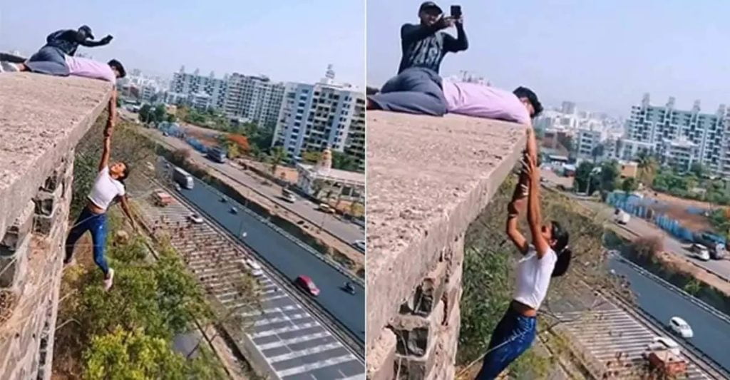 പത്തുനിലക്കെട്ടിടത്തിനു മുകളില്‍ തൂങ്ങിക്കിടന്ന് റീല്‍സ്; യുവതിയും സുഹൃത്തും അറസ്റ്റില്‍