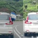 കാറിന്റെ ഡോറിലിരുന്ന് യാത്ര; യുവാവിനെതിരെ നടപടിയെടുത്ത് എംവിഡി