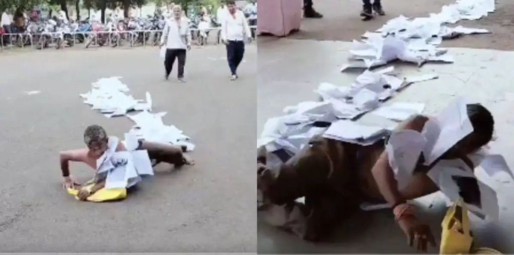 കഴുത്തില്‍ കെട്ടിത്തൂക്കിയ പരാതികളുമായി കളക്‌ട്രേറ്റില്‍ ഇഴഞ്ഞെത്തി വയോധികൻ; വൈറലായി വീഡിയോ